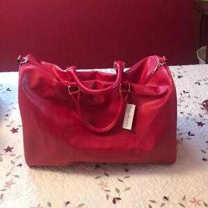 Huge red overnight tote bag. Never used .
Lulu Dharma